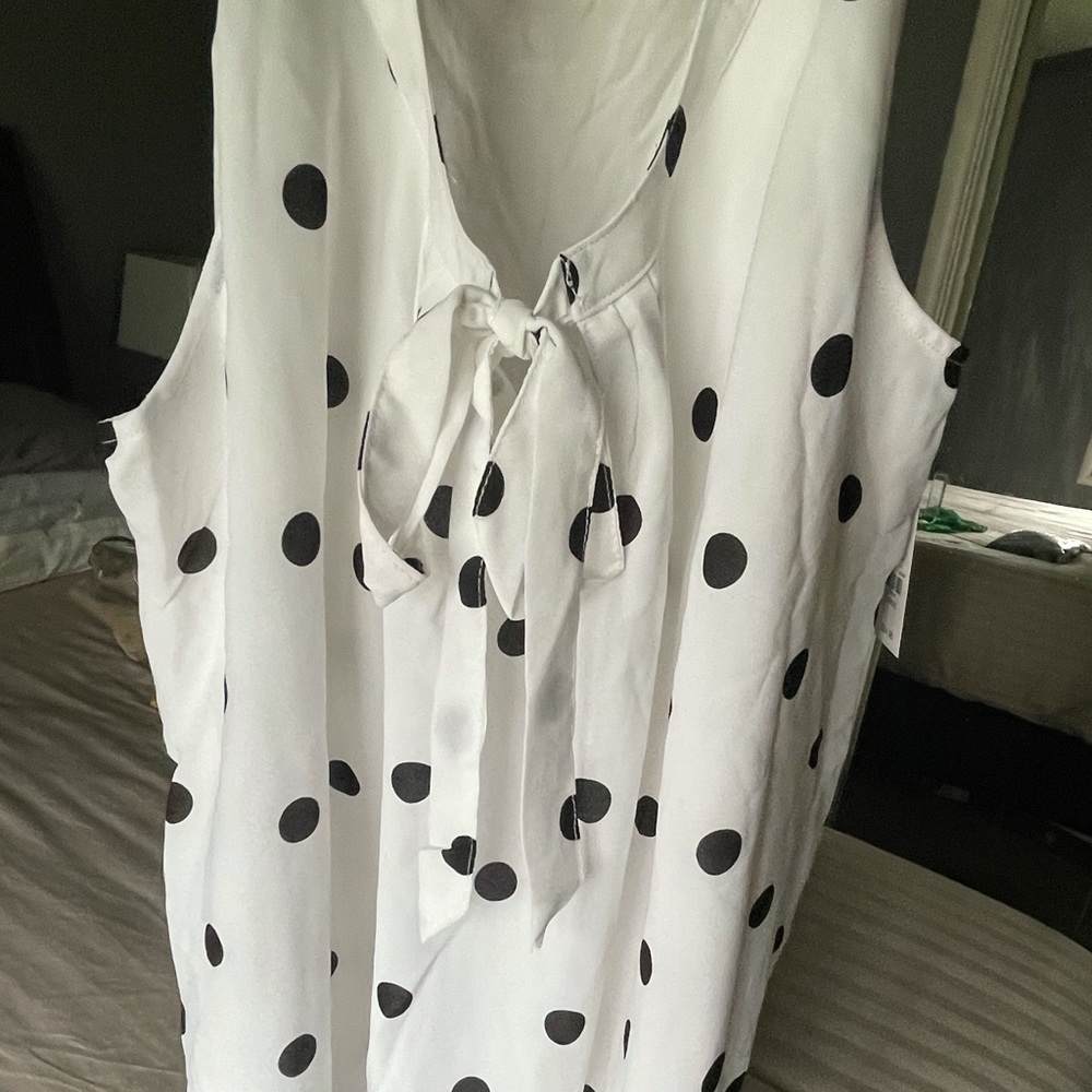 Sleeveless white with black pok a dots
